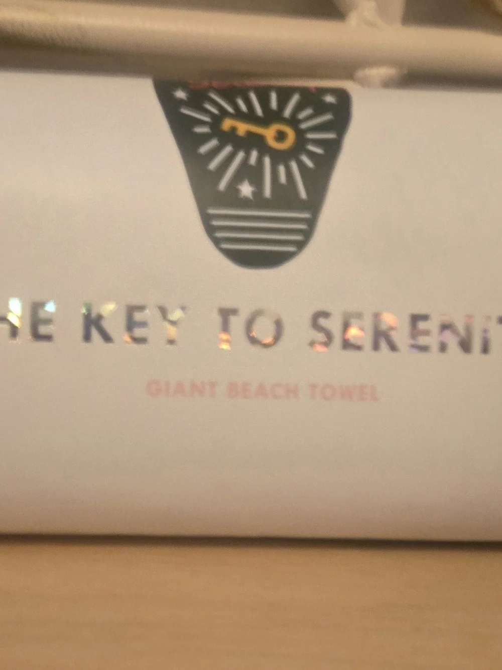 ban.do Green Beach Towel with Pink Typography and Yellow Key Graphic